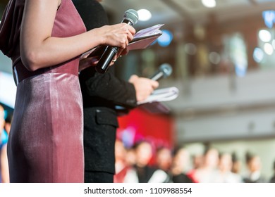 Master Of Ceremonies With Microphone On Stage