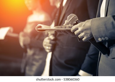 Master Of Ceremonies With Microphone On Stage