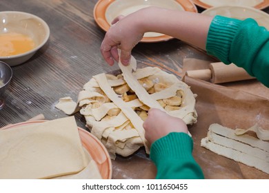 Master class for children on baking pie. Young children learn to cook a sweet pie. Kids preparing homemade pie. Little cook.
