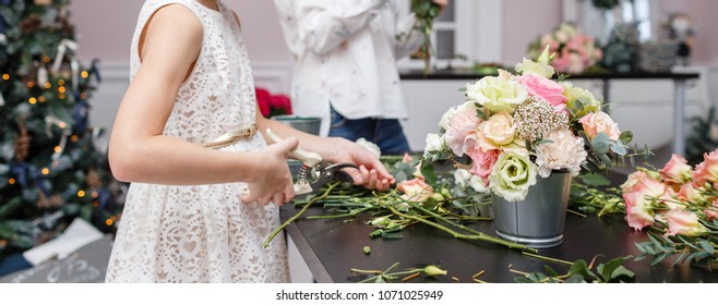 Master class on making bouquets for kids. Spring bouquet in metal ornamental flowerpot. Learning flower arranging, making beautiful bouquets with your own hands
