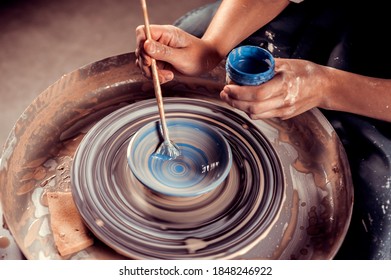 Master class on modeling of clay on a potter's wheel In the pottery workshop - Powered by Shutterstock