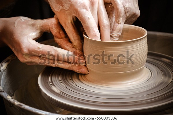 Master class on modeling of clay on a potter\'s\
wheel In the pottery\
workshop
