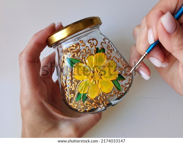 Master class on\
stained glass painting on a small ceramic jar with a brush, drawing\
school. Hobbies for women, housewives, children. Flower pattern,\
gold ornament, handmade