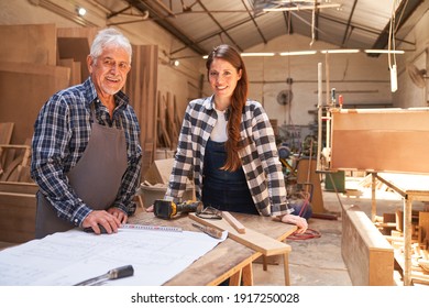 Master Craftsman And Young Woman As An Apprentice In The Carpentry Workshop