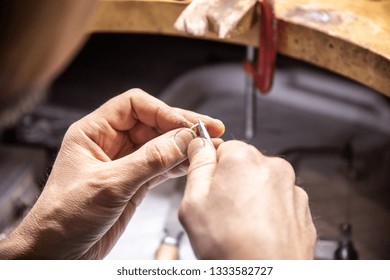 master creates a ring in the jewelry workshop - Shutterstock ID 1333582727