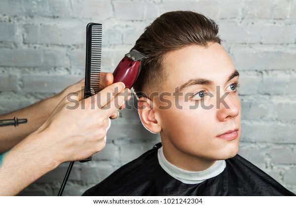 Master Cuts Hair Young Guy Barbershop Royalty Free Stock Image