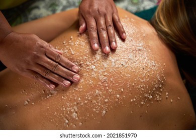 The master does a back massage with special oils and sea salt, spa treatments - Powered by Shutterstock