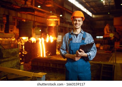 Master at furnace with liquid metal, steel factory - Powered by Shutterstock