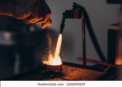 The master jeweler heats the metal for making jewelry - Shutterstock ID 1656929659