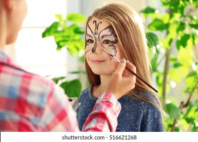 Master Making Aqua Makeup On Girls Face