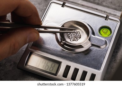 Master Measures The Weight Of Gemstones On Jewelry Scales, Closeup