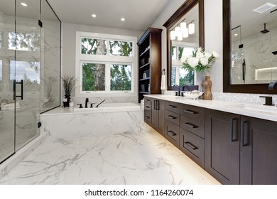 Master Modern Bathroom Interior In Luxury Home With Dark Hardwood Cabinets, White Tub And Glass Door Shower