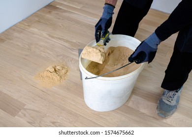 Master Parquet. Preparation Of Parquet Grout Material. Mixing Retainer, Varnish And A Small Mixture Of Wood. Pre-varnishing Phase