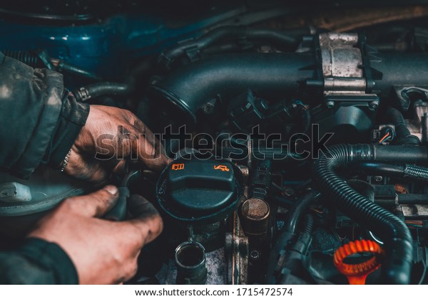 the master repairs the engine in the car\
service during a\
malfunction