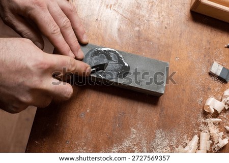 The master sharpens the cutting tool
