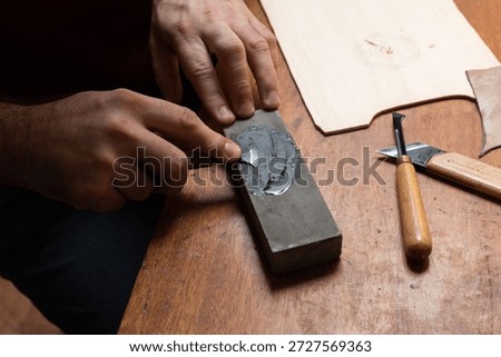 The master sharpens the cutting tool