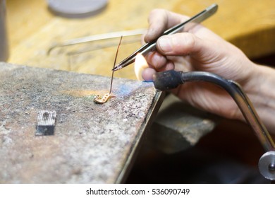 Master soldering jeweller. Picture of hands and product close up. - Shutterstock ID 536090749