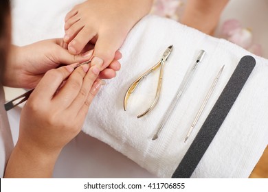 Master using professional instruments when doing pedicure