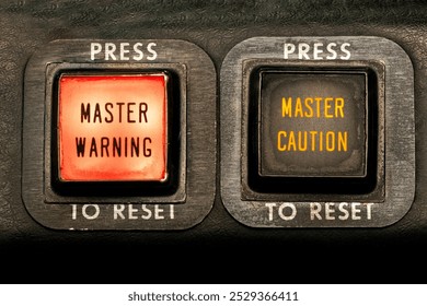 Master Warning, Master Caution. Warning lights in the flight deck on an aircraft alert pilots of an emergency. annunciator push buttons illuminate to signal alarm in the cockpit. Aviation safety