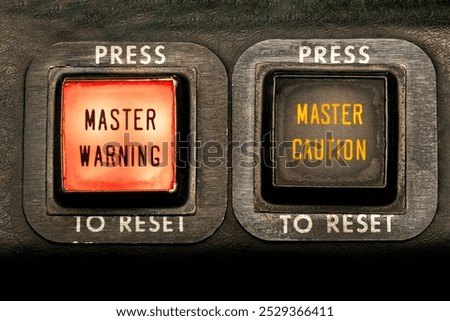 Master Warning, Master Caution. Warning lights in the flight deck on an aircraft alert pilots of an emergency. annunciator push buttons illuminate to signal alarm in the cockpit. Aviation safety