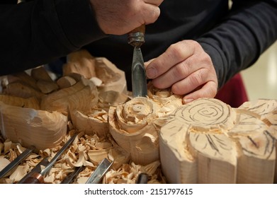 Master woodcarver at work. Wood shavings, gouges and chisels on the workbench. Close up. - Shutterstock ID 2151797615