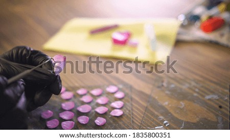 Similar – Baby Mädchen spielt mit Haarspangen, die auf dem Boden sitzen.