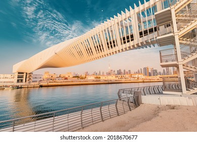 A masterpiece of modern design in architecture - the spiral pedestrian bridge over the water channel in Dubai, UAE tourist attractions - Powered by Shutterstock