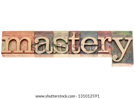 mastery  - isolated word in vintage letterpress wood type printing blocks