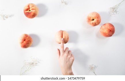 Masturbation. Woman touches herself. Massage of sexual caresses. Finger caress peach. Peaches flat lay. 