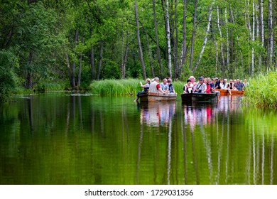 MASURIA, POLAND - JULY 13: Unidentified People Take Boat Trip On Krutynia River On July 13, 2012 In Masurian District, Poalnd. More Than 5 Million Tourists Visit Masuria Every Year.