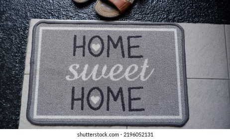 The Mat That Says Home Sweet Home Is Usually Placed In Front Of The Main Door