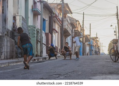MATANZAS, CUBA - Jul 08, 2022: The Little Boys Playing Baseball On The Streets Of Matanzas, Cuba