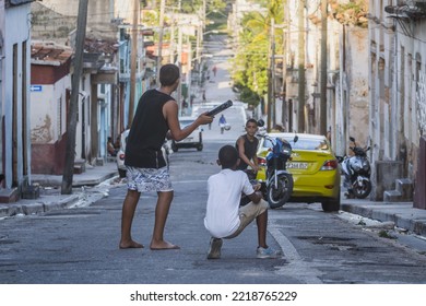 MATANZAS, CUBA - Jul 08, 2022: The Little Boys Playing Baseball On The Streets Of Matanzas, Cuba