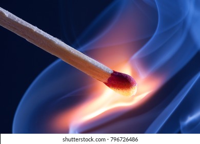 A match take fire and causes smoke emission
