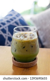Matcha green tea with Espresso Latte in glass on wooden table with copy space. - Shutterstock ID 1393690655