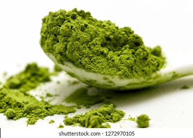 Matcha Green Tea Extract Powder And Teaspoon Isolated White Background