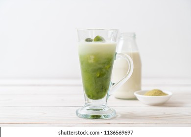 matcha green tea ice cube with milk in glass - Shutterstock ID 1136569697