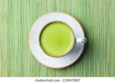 Matcha, Green Tea Latte In A Cup. Green Bamboo Background. Close Up. Top View.