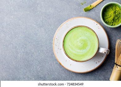 Matcha green tea latte in a cup. Top view. Copy space.
