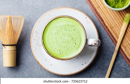 Matcha green tea latte in a cup. Top view.
