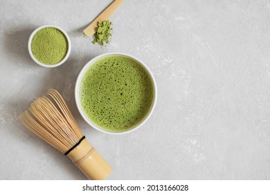Matcha green tea set on a gray concrete background. Japanese traditional drink. View from above. Copy space.