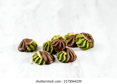 Matcha Greentea Cookies with Almond SLice and Dark Chocolated Coating, White Background