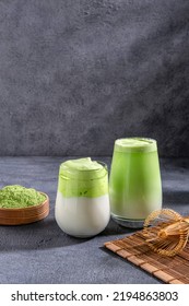 Matcha tea. Iced green tea matcha latte  in glass. Green tea dalgona, whipped grean tea with milk. Healthy vegan drink, close up.