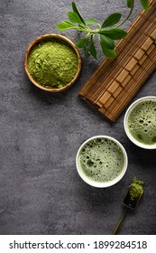 Matcha tea powder and tea accessories on dark background.Tea ceremony. Healthy drink. Traditional japanese drink.