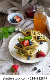 Matcha waffles with syrup and berries