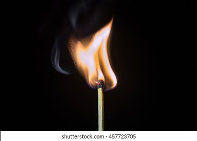 Matches and fire On a black background