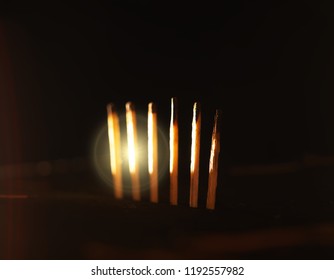 Matches on the table with dramatic lightning background