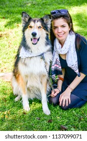 Matching Dog And Owner Outfit. Girl And Her Collie Dog  With Matching Bandana