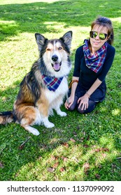 Matching Dog And Owner Outfit. Girl And Her Collie Dog  With Matching Bandana