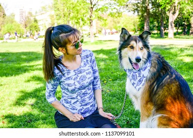 Matching Dog And Owner Outfit. Girl And Her Collie Dog  With Matching Bandana